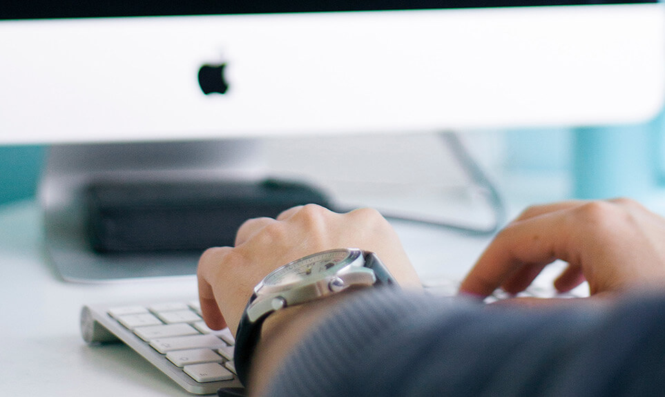 Man typing on a computer